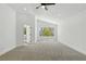 A large main bedroom featuring a ceiling fan, recessed lights and a window with views of the backyard at 2105 Madagascar Ln, Las Vegas, NV 89117