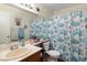 Cozy bathroom featuring white countertop, oak cabinets and a bathtub with nautical themed shower curtain at 2243 Aspen Mirror Way # 102, Laughlin, NV 89029