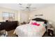 Comfortable bedroom with a ceiling fan, a dresser, and a window for natural light at 2243 Aspen Mirror Way # 102, Laughlin, NV 89029