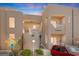 Inviting two-story condo showcasing well-maintained landscaping and a charming facade at 2243 Aspen Mirror Way # 102, Laughlin, NV 89029