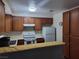 Well-lit kitchen with white countertops, oak cabinets, and white appliances at 2243 Aspen Mirror Way # 102, Laughlin, NV 89029