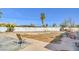 Backyard featuring a minimalist landscape, palm trees and fenced perimeter at 2450 Tournament St, Las Vegas, NV 89142