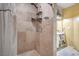 Bathroom featuring a shower with tile and shower-head, and a sink with storage at 2450 Tournament St, Las Vegas, NV 89142