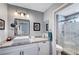 Bathroom featuring granite countertops, modern lighting, and a walk-in shower at 2456 Desert Butte Dr, Las Vegas, NV 89134