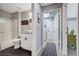 Bathroom with tub/shower, modern vanity, and view to laundry and a desk in a bedroom at 2456 Desert Butte Dr, Las Vegas, NV 89134
