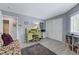 Bright bedroom with a desk, closet, and comfortable seating area at 2456 Desert Butte Dr, Las Vegas, NV 89134