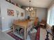 Elegant dining room with a large wooden table, chandelier, and decorative wall art at 2456 Desert Butte Dr, Las Vegas, NV 89134