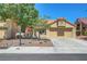 Charming single-story home featuring a well-maintained lawn, desert landscaping, and a spacious two-car garage at 2456 Desert Butte Dr, Las Vegas, NV 89134