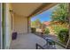 Covered patio with desert landscaping, seating, and views of the property at 2456 Desert Butte Dr, Las Vegas, NV 89134