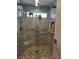 Modern shower with glass door, mosaic floor, and rainfall showerhead at 2456 Desert Butte Dr, Las Vegas, NV 89134