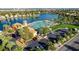 Aerial view of a lakeside community featuring lush landscaping and ample parking at 2512 Huber Heights Dr, Las Vegas, NV 89128