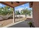 Relaxing backyard with gravel landscaping, patio, and mature trees at 2512 Huber Heights Dr, Las Vegas, NV 89128