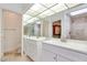 Bathroom with double sinks, modern vanity, and mirrored wall above the sink at 2723 Seabridge Dr, Las Vegas, NV 89121