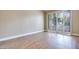 Bedroom with wood flooring and large sliding glass doors to a private patio at 2723 Seabridge Dr, Las Vegas, NV 89121