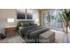 Comfortable bedroom featuring a king bed, soft lighting, and a patio exit at 2723 Seabridge Dr, Las Vegas, NV 89121
