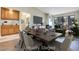 Open dining room with modern lighting, a wet bar, and access to the outdoors at 2723 Seabridge Dr, Las Vegas, NV 89121