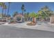Community entrance with lush landscaping and a gate, providing security and curb appeal at 2723 Seabridge Dr, Las Vegas, NV 89121