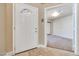 Welcoming front door entry with tile floors and a view into the carpeted living room at 2723 Seabridge Dr, Las Vegas, NV 89121