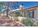 Townhouse with red tile roof, neutral stucco, and private outdoor patio space at 2723 Seabridge Dr, Las Vegas, NV 89121