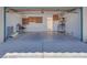 Two-car garage with storage shelves and plenty of parking space at 2723 Seabridge Dr, Las Vegas, NV 89121