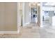 Hallway with a laundry room on the left and a kitchen in the background at 2723 Seabridge Dr, Las Vegas, NV 89121