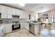 Modern kitchen featuring white cabinets, stainless steel appliances, and a stylish backsplash at 2723 Seabridge Dr, Las Vegas, NV 89121