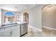Modern kitchen with stainless steel appliances, white cabinets, and granite countertops at 2723 Seabridge Dr, Las Vegas, NV 89121