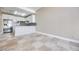 Bright eat-in kitchen with white cabinets, stainless steel appliances, and tile backsplash at 2723 Seabridge Dr, Las Vegas, NV 89121