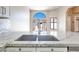 Close-up of granite countertop kitchen sink with stainless steel appliances at 2723 Seabridge Dr, Las Vegas, NV 89121