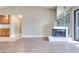 Comfortable living room featuring a fireplace and easy access to the adjacent kitchen at 2723 Seabridge Dr, Las Vegas, NV 89121
