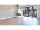 Bright living room with wood flooring, a fireplace, and large sliding glass doors at 2723 Seabridge Dr, Las Vegas, NV 89121