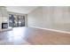 Spacious living room featuring wood floors, a fireplace, and glass sliding doors at 2723 Seabridge Dr, Las Vegas, NV 89121
