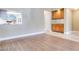Bright living room featuring wood flooring and a bar area with light wood cabinets at 2723 Seabridge Dr, Las Vegas, NV 89121