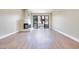 A light and airy living room featuring a fireplace, and sliding glass doors at 2723 Seabridge Dr, Las Vegas, NV 89121