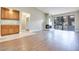 Open living room with a fireplace, light wood flooring, and access to the outdoors at 2723 Seabridge Dr, Las Vegas, NV 89121