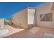 Private outdoor tiled patio and gate access to green space on a sunny day at 2723 Seabridge Dr, Las Vegas, NV 89121