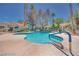 Community pool area with ample seating and lush tropical landscaping at 2723 Seabridge Dr, Las Vegas, NV 89121