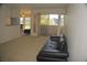 Spacious living room with sliding glass doors to balcony allowing ample natural light at 2831 Geary Pl # 2918, Las Vegas, NV 89109