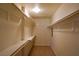 Walk-in closet with custom built in shelving and carpeted flooring at 2831 Geary Pl # 2918, Las Vegas, NV 89109