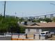 The shot showcases a clear view of the city skyline and architectural landmarks amidst suburban homes at 2921 Country Manor Ln # 139, Las Vegas, NV 89115