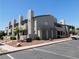 Inviting exterior of a two-story residential building with manicured landscaping and ample parking at 2921 Country Manor Ln # 139, Las Vegas, NV 89115