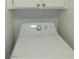 Image shows a white laundry machine with cabinets above it, providing a convenient laundry setup at 2921 Country Manor Ln # 139, Las Vegas, NV 89115