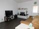 Cozy living room with hardwood floors, a brick fireplace, and comfortable seating at 2921 Country Manor Ln # 139, Las Vegas, NV 89115