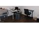 Office area featuring two desks, chairs, and ample storage at 2921 Country Manor Ln # 139, Las Vegas, NV 89115