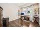 Cozy bedroom with wood flooring, window with drapery, and a vintage vanity desk at 3111 Lido Isle Ct, Las Vegas, NV 89117