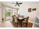 Dining room features a modern chandelier and a sliding door with a view of greenery at 3111 Lido Isle Ct, Las Vegas, NV 89117