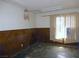 Bedroom with half wood paneled walls, fluorescent lighting and window at 3175 Palmdale St, Las Vegas, NV 89121
