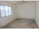 Bedroom with large window and ceiling fan at 3175 Palmdale St, Las Vegas, NV 89121