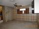 Vintage kitchen with unique wallpaper, a ceiling fan, and wood cabinets at 3175 Palmdale St, Las Vegas, NV 89121