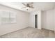 Neutral bedroom features a ceiling fan, window, and closet, ready for your personal touch at 3414 Drescina Way, North Las Vegas, NV 89031